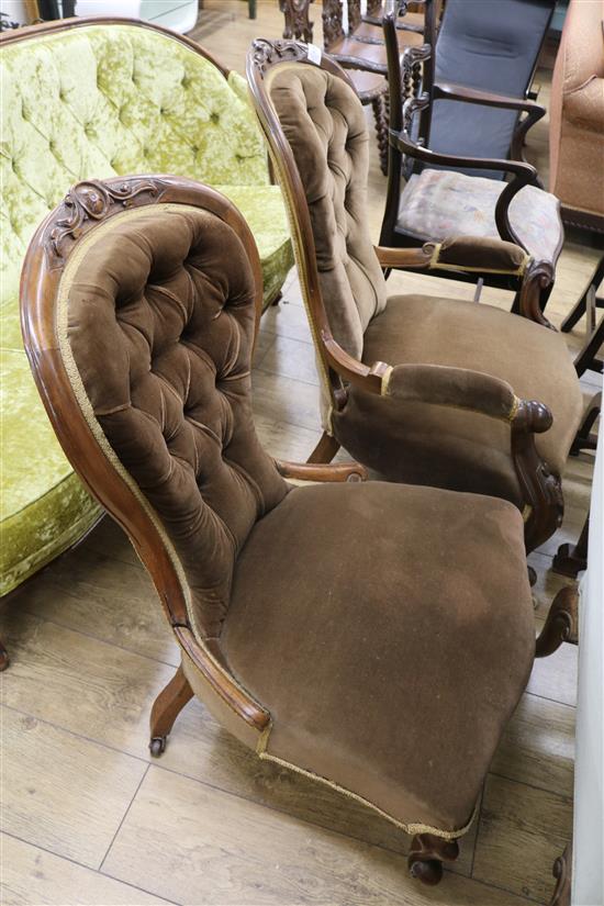 A pair of Victorian ladies and gents button back walnut armchairs